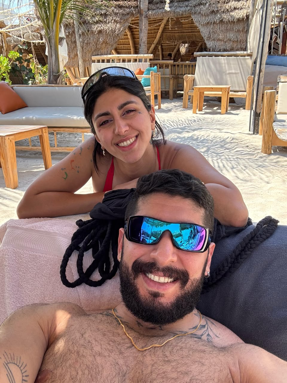 Sadaf and Arash smiling at the beach