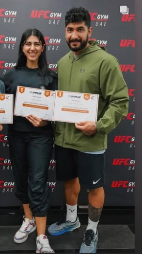 Arash Alikhaniyan and Sadaf Aghaei with IMMAF coaching certificates